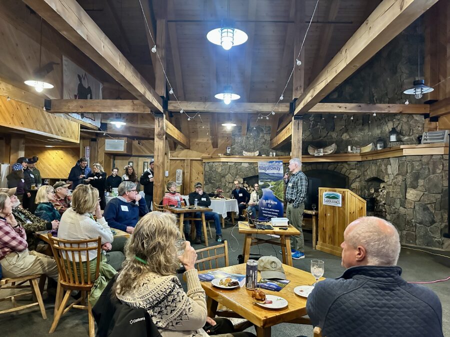 A room of people at the Happy Hour for Nature event in support of the Magalloway
